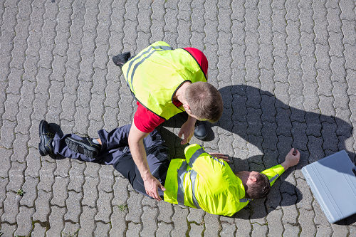 men helping an injured workers